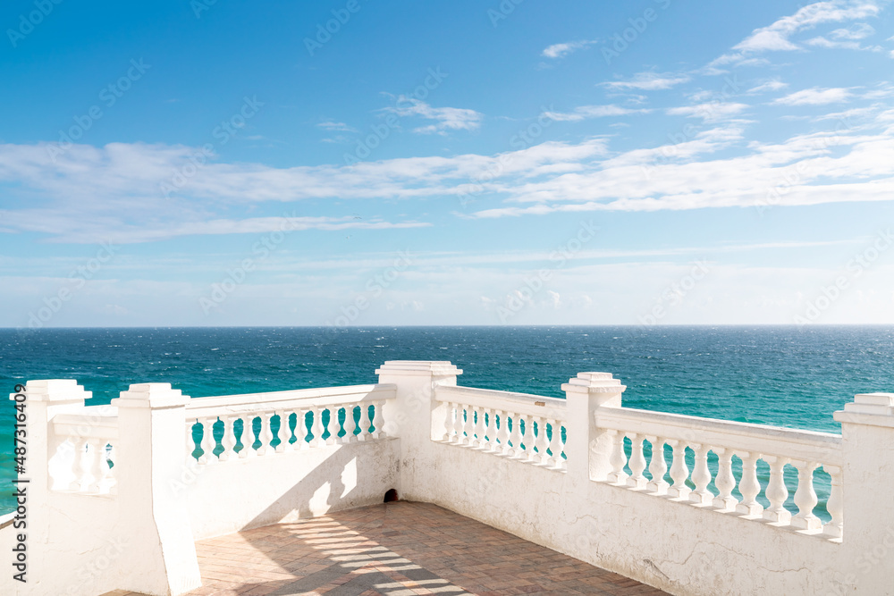 Isolated balcony mirador painted in white. Situated in Nerja city on Carabeo street is a famous location.  Under this balcony is a small and isolated beach maned 