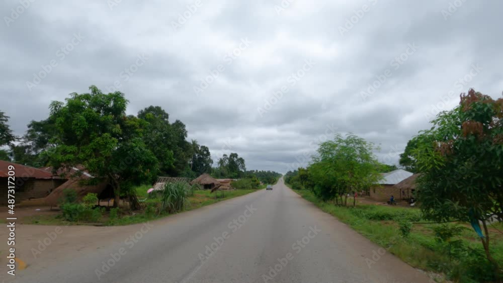 Sierra Leone Africa bush rural village drive POV. West Africa suffers with extreme poverty and hunger. Tropical climate. Transportation limited due to bad roads and infrastructure. Sierra Leone Africa bush rural village drive POV. West Africa suffers with extreme poverty and hunger. Tropical climate. Transportation limited due to bad roads and infrastructure.