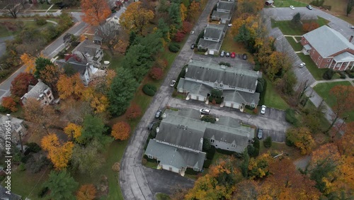 Aerial View of Residential Neighborhood of Small American City in Autumn Season. Towson, Maryland USA, Drone Shot photo