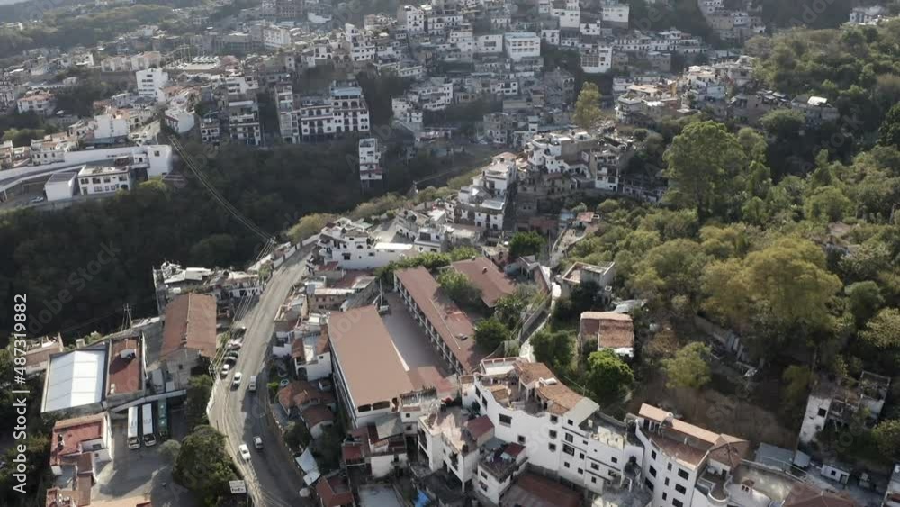 Taxco de Alarcon, Mexico. Aerial View of Hillside Residential Neighborhood, Tilt Up Drone Shot Taxco de Alarcon, Mexico. Aerial View of Hillside Residential Neighborhood, Tilt Up Drone Shot
