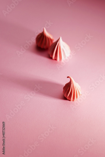 Handmade pink meringue, close-up, texture.