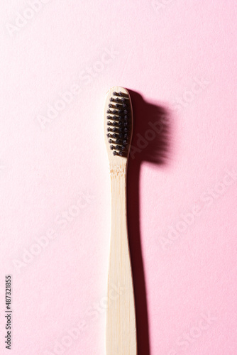 Eco wooden toothbrush. Copy space background