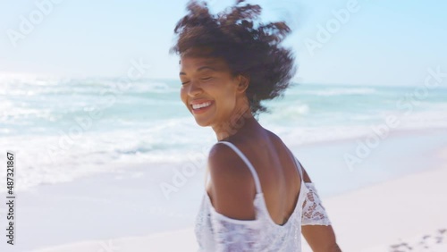 Happy smiling african american woman at beach