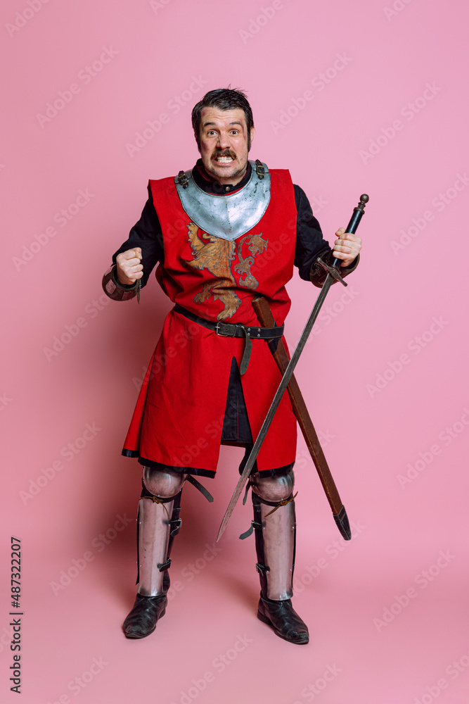 One young man medieval warrior or knight wearing wearing armor