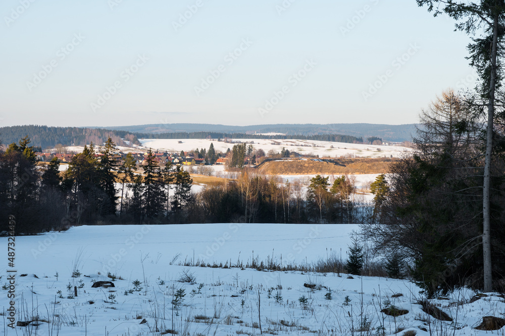 Winter landscape in Czechia with meadows, forests and ponds covered in snow Winter landscape in Czechia with meadows, forests and ponds covered in snow