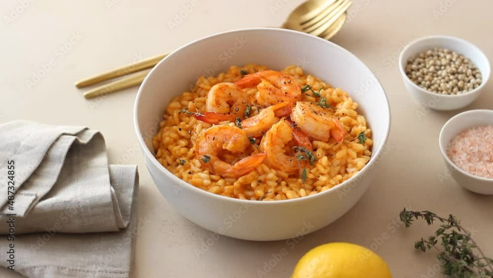 Risotto with shrimps, tomatoes and thyme. Italian food. Risotto with shrimps, tomatoes and thyme. Italian food.