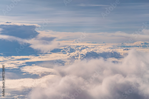 View over the clouds above Tanzania. Bright skyscape © garrykillian
