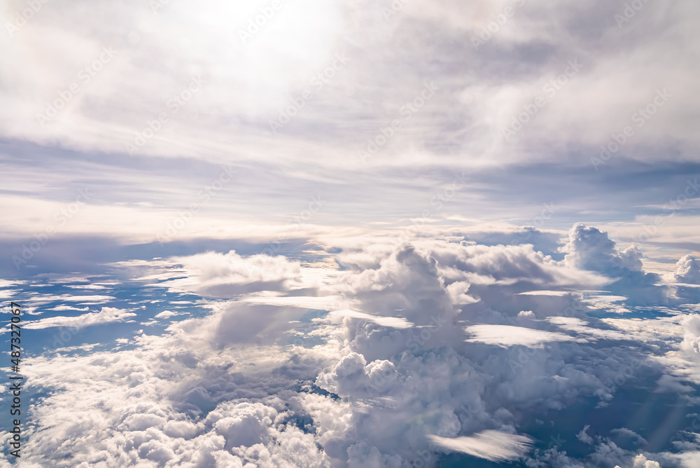 Fototapeta premium View over the clouds above Tanzania. Bright skyscape