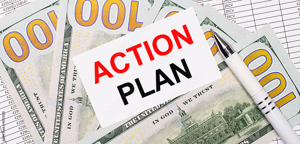 Against the background of reports and dollars - a white pen and a card with the text ACTIOON PLAN. Business concept Against the background of reports and dollars - a white pen and a card with the text ACTIOON PLAN. Business concept