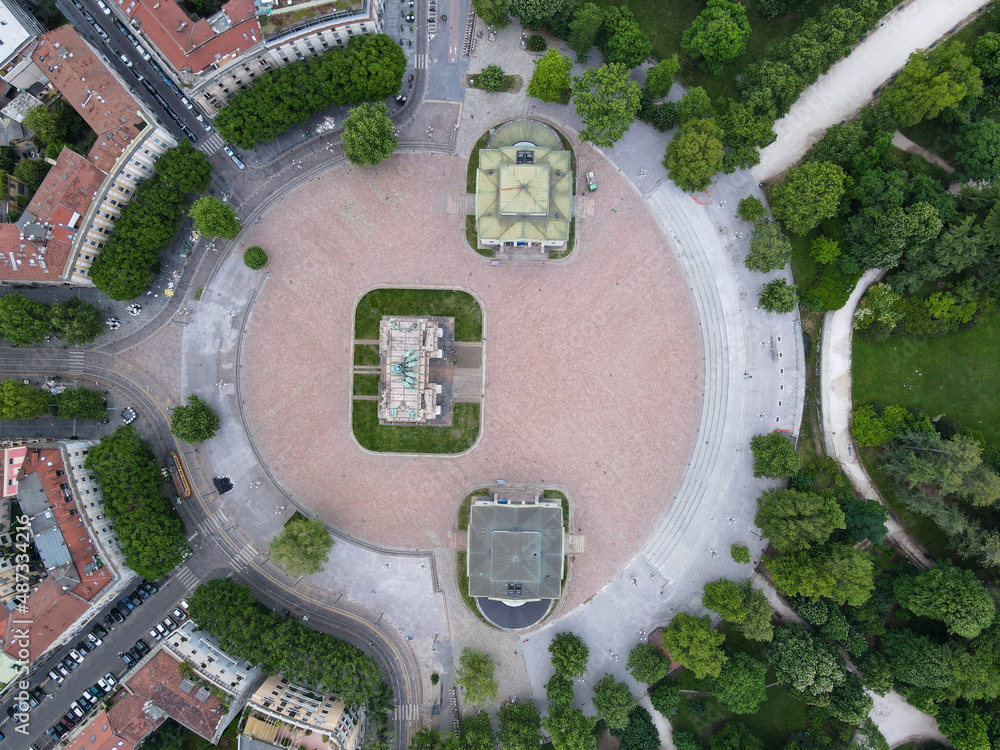 Aerial view of Arco della Pace in Milano, north Italy. Drone photography of Arch of Peace in Piazza Sempione, near Sempione park in the heart of Milan, Lombardy and Sforza Castle.