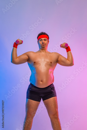 Fat man with dumbbells want to lose weight and become a slim athlete. Fitness concept. © Mike Orlov