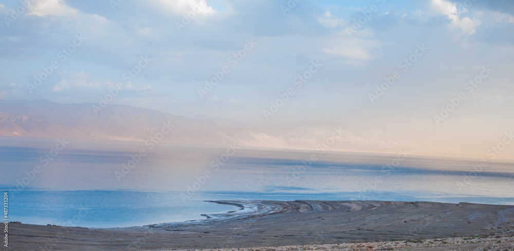 mountains and dead sea at sunset of a sunny day
