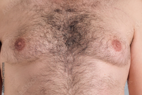 фотографія Close up look of a caucasian man hairy chest, with overweight