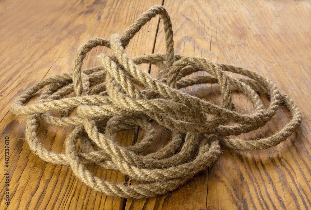 Brown nautical strong rope on the table close-up Brown nautical strong rope on the table close-up