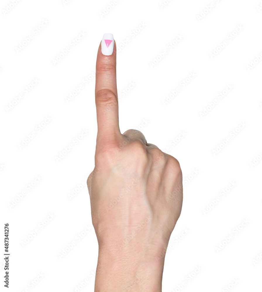 Pointing gesture. Female hand shows index finger with rose triangle manicure. Symbol of lesbian, gay, bisexual, transgender and queer pride isolated on white background. Pointing gesture. Female hand shows index finger with rose triangle manicure. Symbol of lesbian, gay, bisexual, transgender and queer pride isolated on white background.