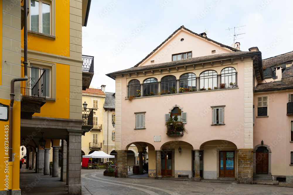 View of central Market Square with colorful houses in historic center of small Italian town of Domodossola on winter day..