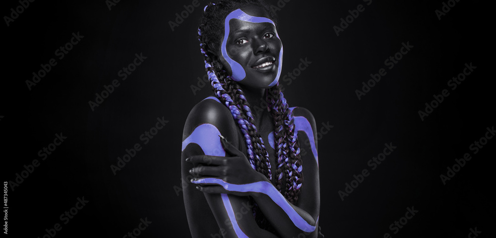 Neon concept. Pink and black body paint. Woman with face art. Young girl with bodypaint. An amazing model with makeup. Neon concept. Pink and black body paint. Woman with face art. Young girl with bodypaint. An amazing model with makeup.
