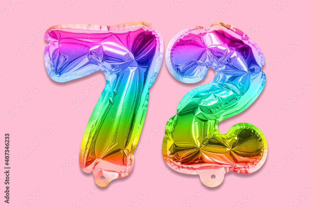 Rainbow foil balloon number, digit seventy two on a pink background. Birthday greeting card with inscription 72. Top view. Numerical digit. Celebration event, template. Rainbow foil balloon number, digit seventy two on a pink background. Birthday greeting card with inscription 72. Top view. Numerical digit. Celebration event, template.