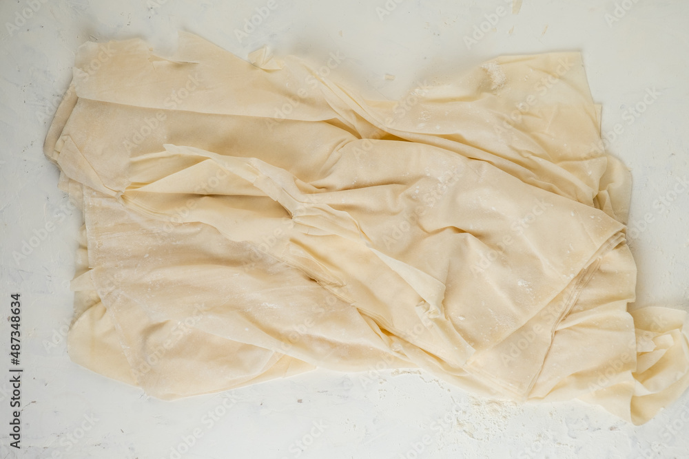 Obraz premium Homemade phyllo dough thin sheets. top view