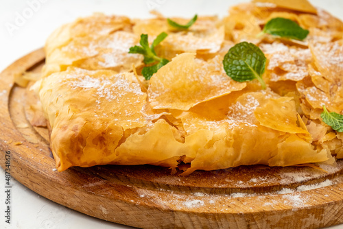 Greek bougatsa sweet phyllo pastry pastry close-up.