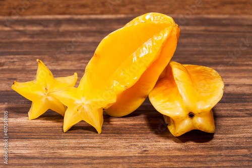 Averrhoa Carambolo - Star Fruit Or Carambola; Photo On Wooden Background photo