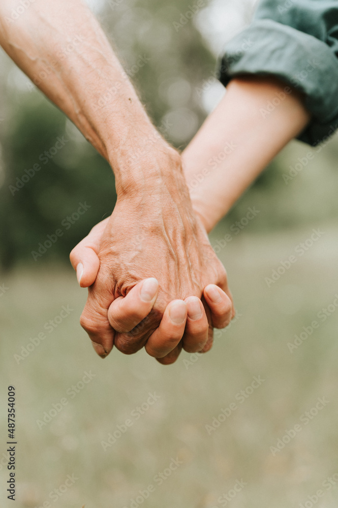 happy senior couple holding hands. hands of man and woman hold each other. romance and love and support in elderly family. faceless husband and wife travel together in nature. people countryside life happy senior couple holding hands. hands of man and woman hold each other. romance and love and support in elderly family. faceless husband and wife travel together in nature. people countryside life