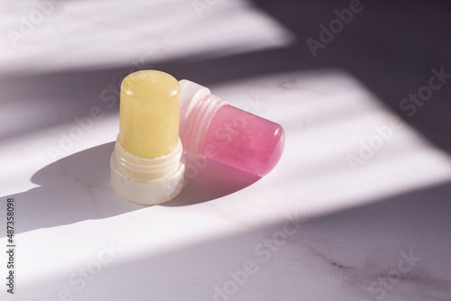 Wallpaper Mural Alunite Crystal eco deodorant in a stick on a light marble background. Ecological antiperspirant in crystal.  Torontodigital.ca