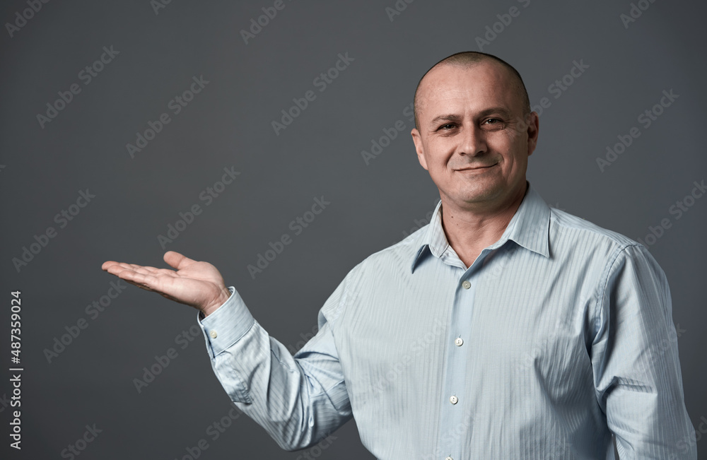 Senior businessman presenting a product Senior businessman presenting a product