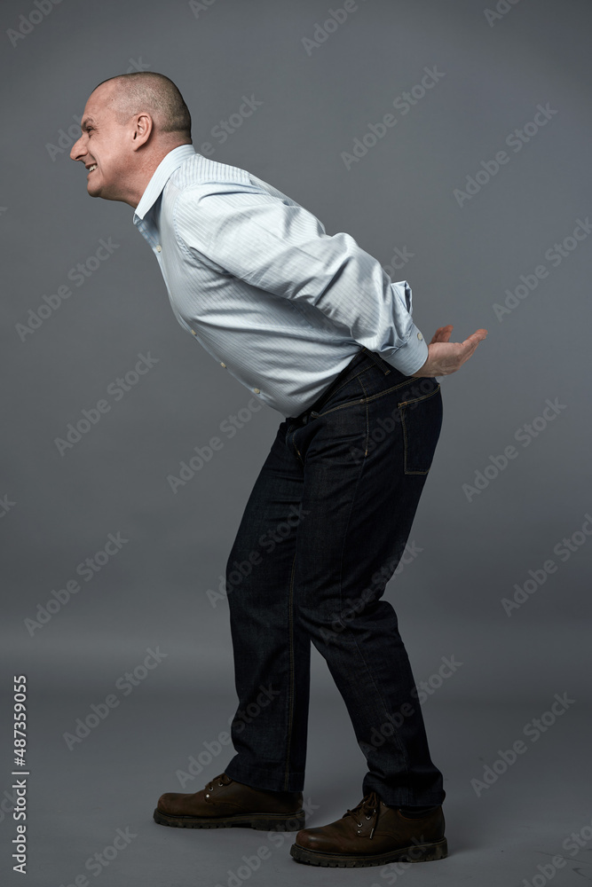 Businessman carrying something on his back Businessman carrying something on his back