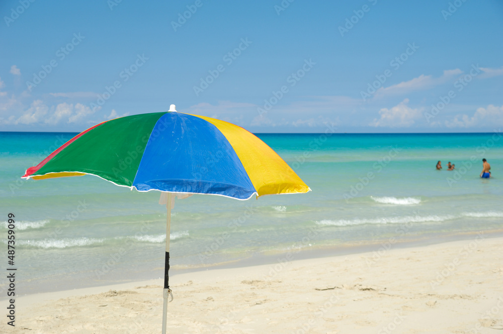 Parasol on exotic beach