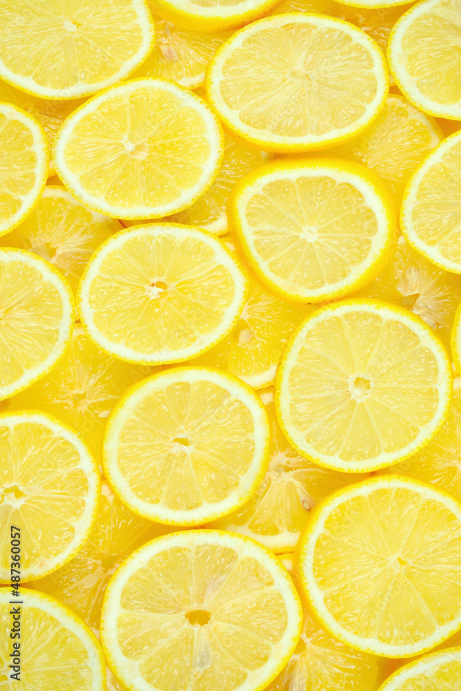 A slices of fresh juicy yellow lemons.  Texture background, pattern