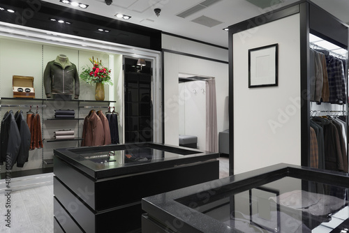 Modern interior of men s clothing and accessories store in black and white colors.