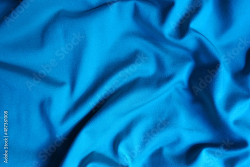 Φωτογραφία Top view of draped cerulean blue polyester fabric