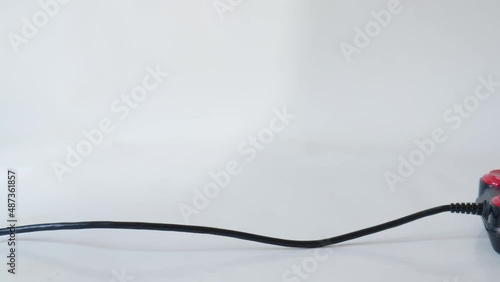 Classic Retro Joystick from the Eighties on white. Camera moving along cable on white background. photo