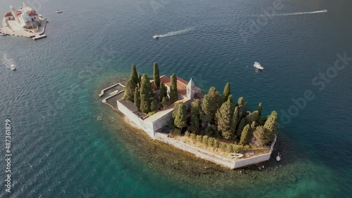 Aerial Partial Orbit Saint George Small Medieval Monastery Island in Adriatic Sea Bay of Perast Montenegro Summer Golden Hour Drone 4k photo