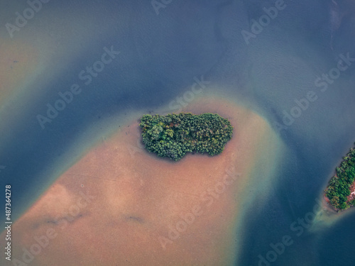 abstract island in a dark sea and sand background in Robertsport, Liberia photo