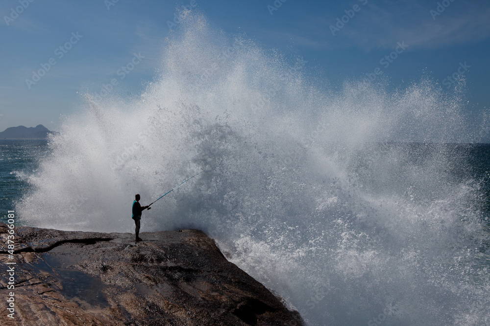 Big waves caused by the undertow crashing against the rocks at Rio de Janeiro, Brazil Big waves caused by the undertow crashing against the rocks at Rio de Janeiro, Brazil