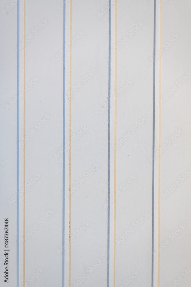 Vertical blue and beige stripe all-over wallpaper pattern on white textured background Vertical blue and beige stripe all-over wallpaper pattern on white textured background