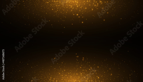 Glowing light effect in yellow gold color with lots of shiny particles isolated on dark background. Vector star cloud with dust.