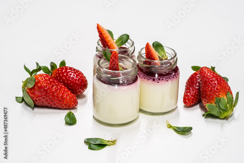 Pannacotta with strawberries in a glass decorated with fresh berries; strawberry dessert; creamy dessert in a glass;

