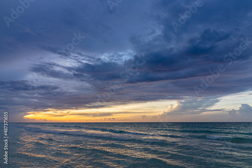 Beautiful sunset on the ocean shore in the evening