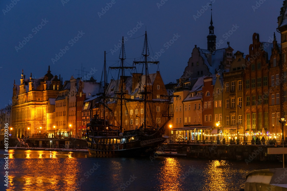 Fototapeta premium Shining illuminated night street of the old city