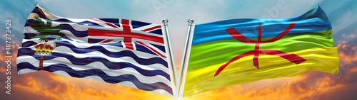 Commissioner of the British Indian Ocean Territory flag and Berber Amazigh Flag waving with texture sky Cloud and sunset Double Flag   photo