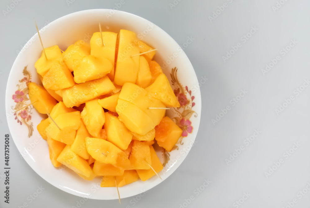 Papaya fruit in dish on white background with copy space Papaya fruit in dish on white background with copy space