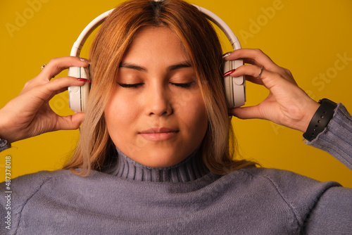 Asian-looking woman in headphones