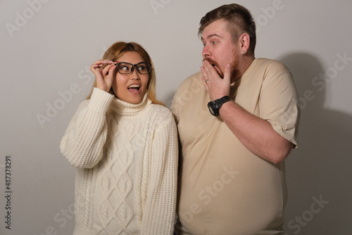 Man and woman on a gray background
