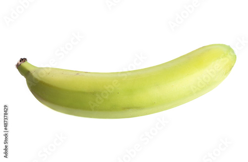 Close-up of an unripe banana isolated on a white background.