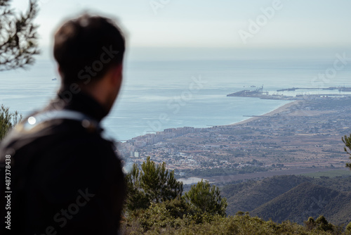 Mountain landscape with man out of focus.