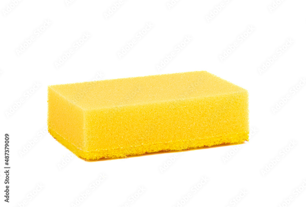 Close-up of a yellow sponge for washing dishes on a white background. Close-up of a yellow sponge for washing dishes on a white background.