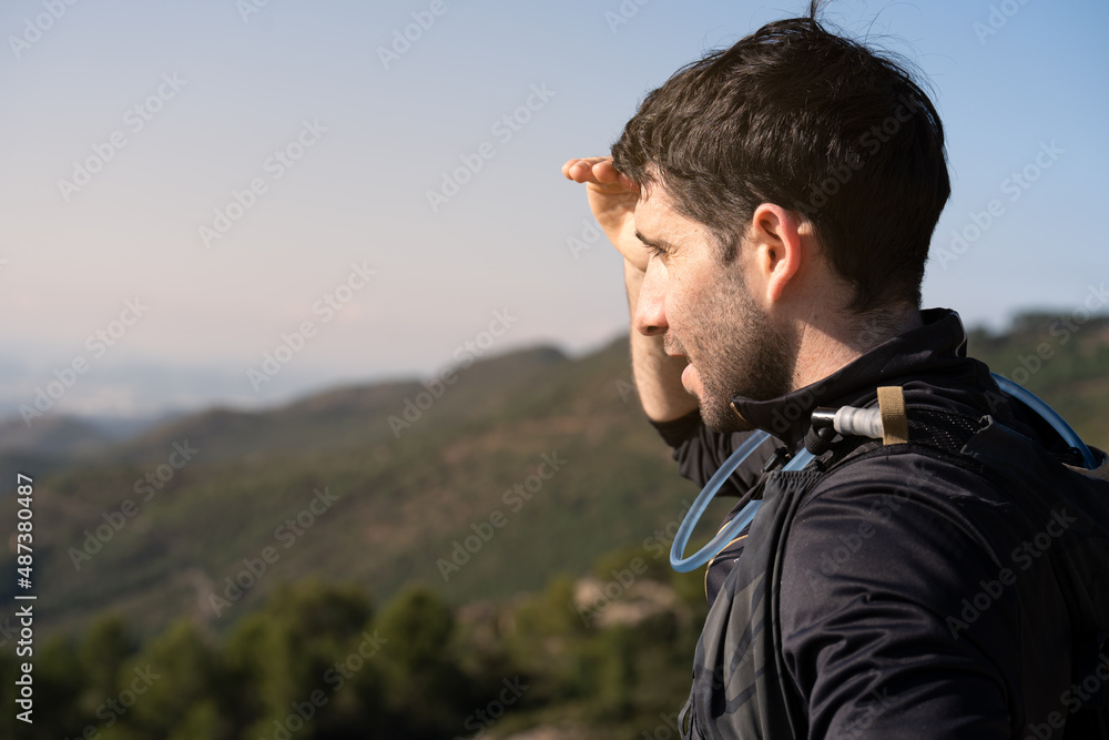 Young runner in the mountains enjoying the view. Young runner in the mountains enjoying the view.